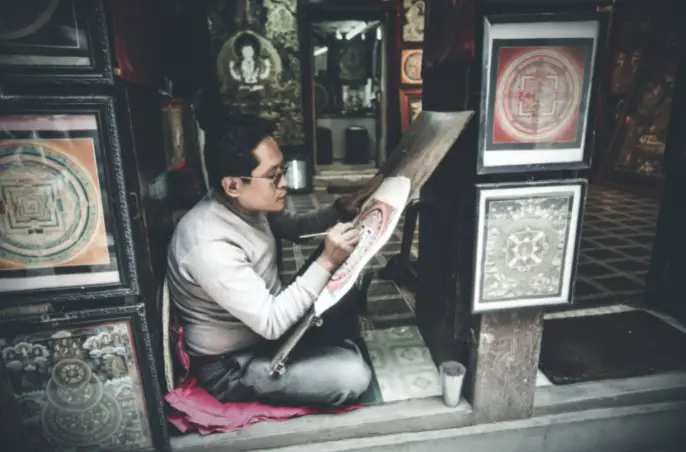 Artist painting in studio