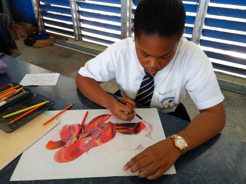 Student working with Prismacolor pencils