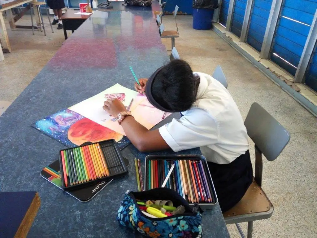 Student working with colored pencils