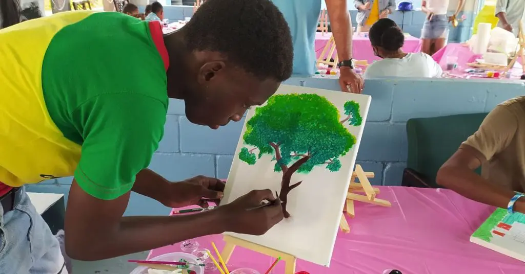 Boy Painting a Tree