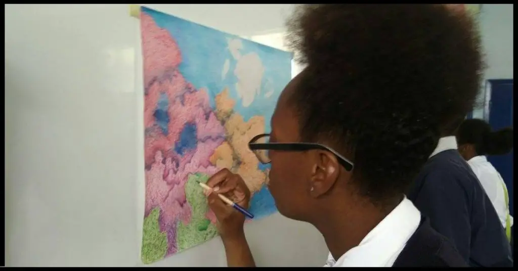 A student working on a colored drawing