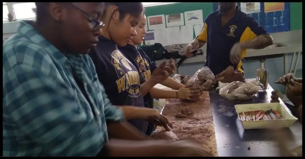 Students working with clay
