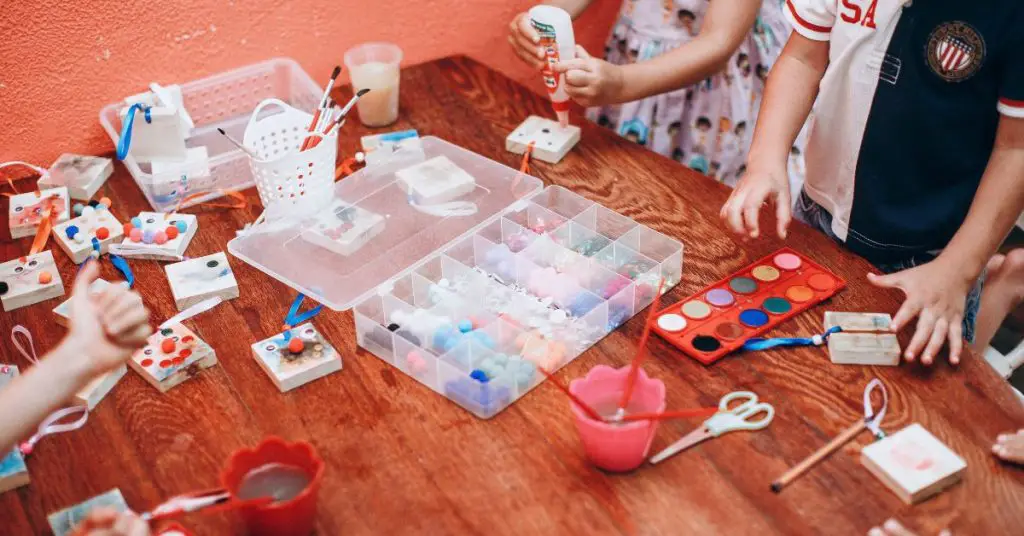 Children painting at a table