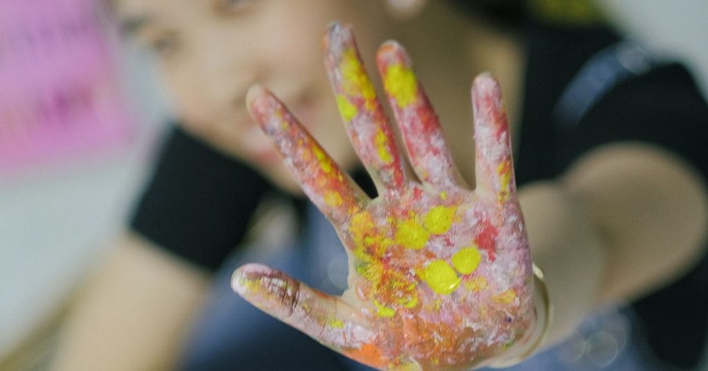 Girl with painted palm